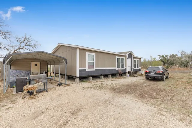 a house with yard in front of it