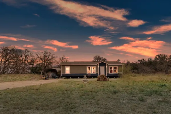 a house with yard and garden