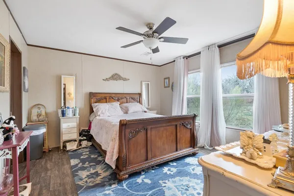 a bed room with a bed and a window