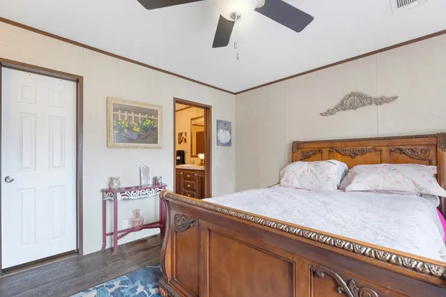 a bedroom with a bed and cabinets