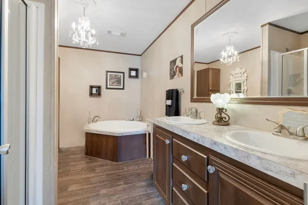 a bathroom with a sink double vanity and a mirror
