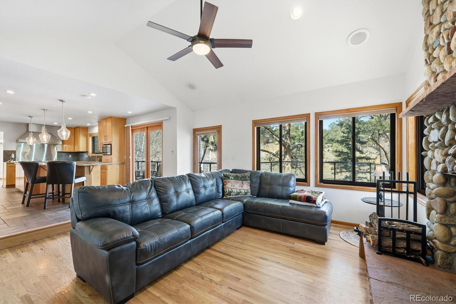 2565 Nova Road Pine, CO 80470 - Photo 13 of 50 a living room with furniture and a large window
