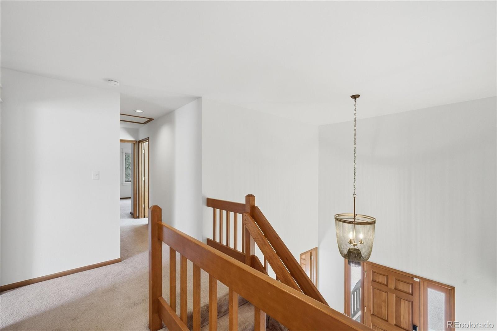 2565 Nova Road Pine, CO 80470 - Photo 18 of 50 a view of hallway with windows