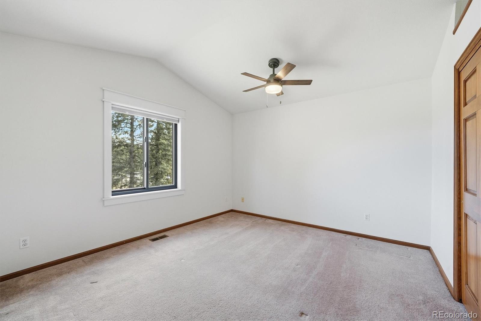 2565 Nova Road Pine, CO 80470 - Photo 25 of 50 an empty room with a window