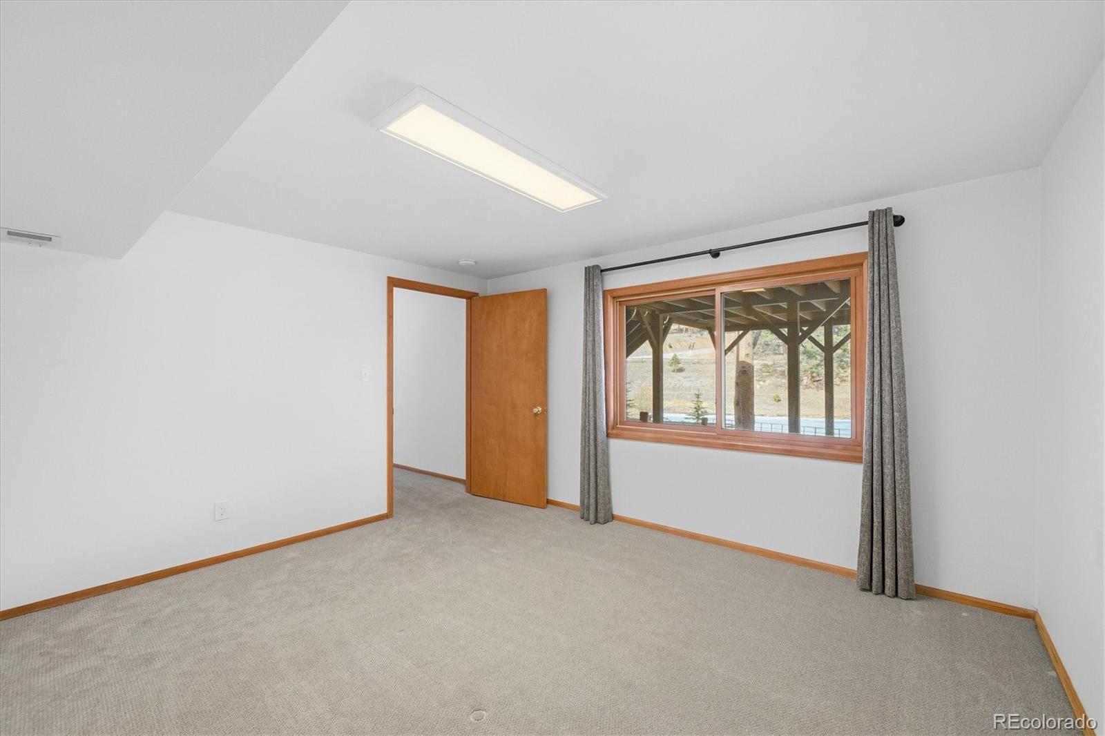 2565 Nova Road Pine, CO 80470 - Photo 34 of 50 an empty room with windows