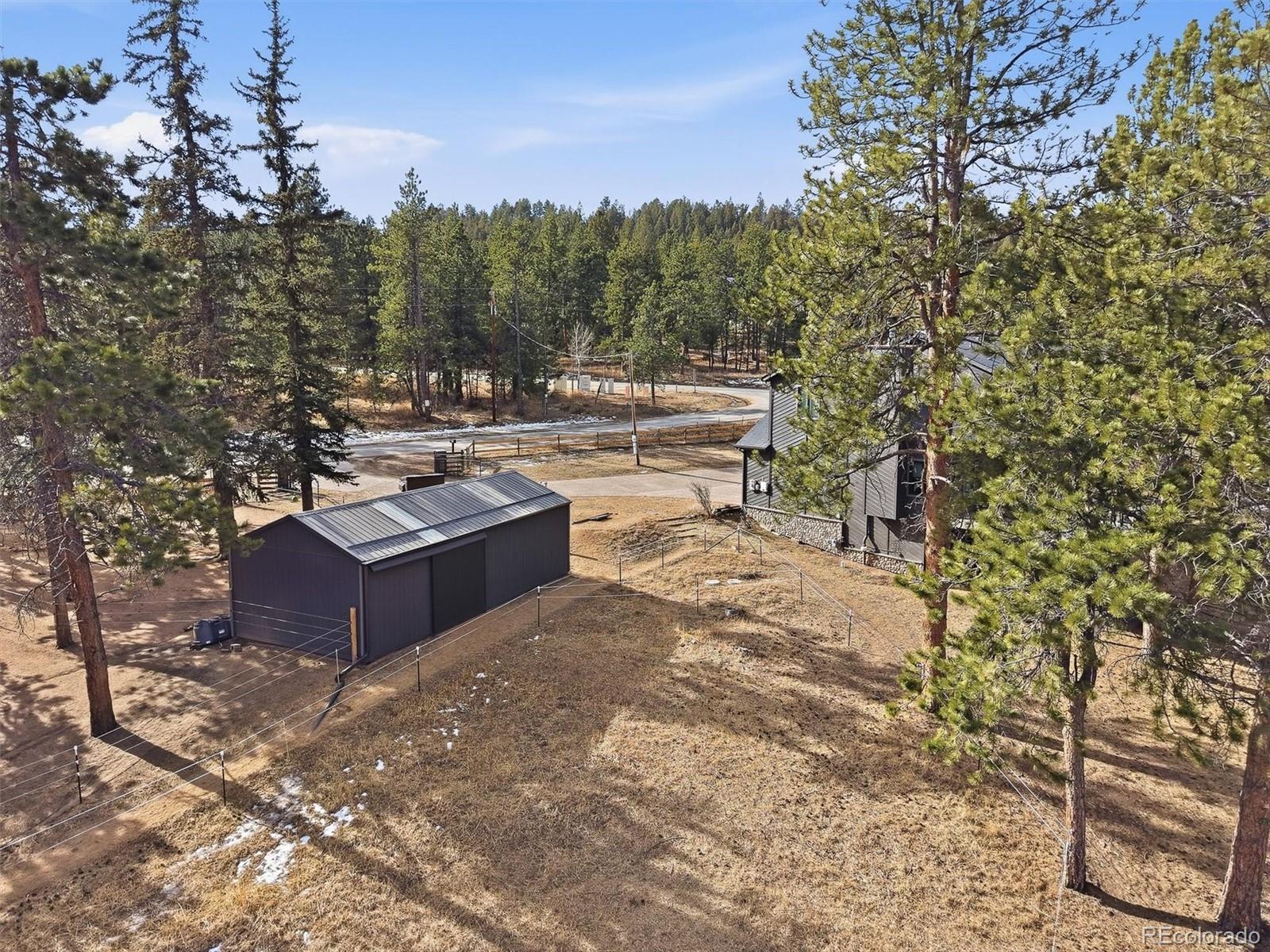 2565 Nova Road Pine, CO 80470 - Photo 38 of 50 a view of a backyard with sitting area