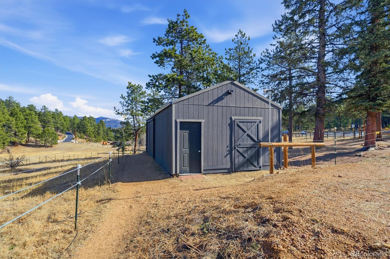 2565 Nova Road Pine, CO 80470 - Photo 39 of 50 a house with trees in the background
