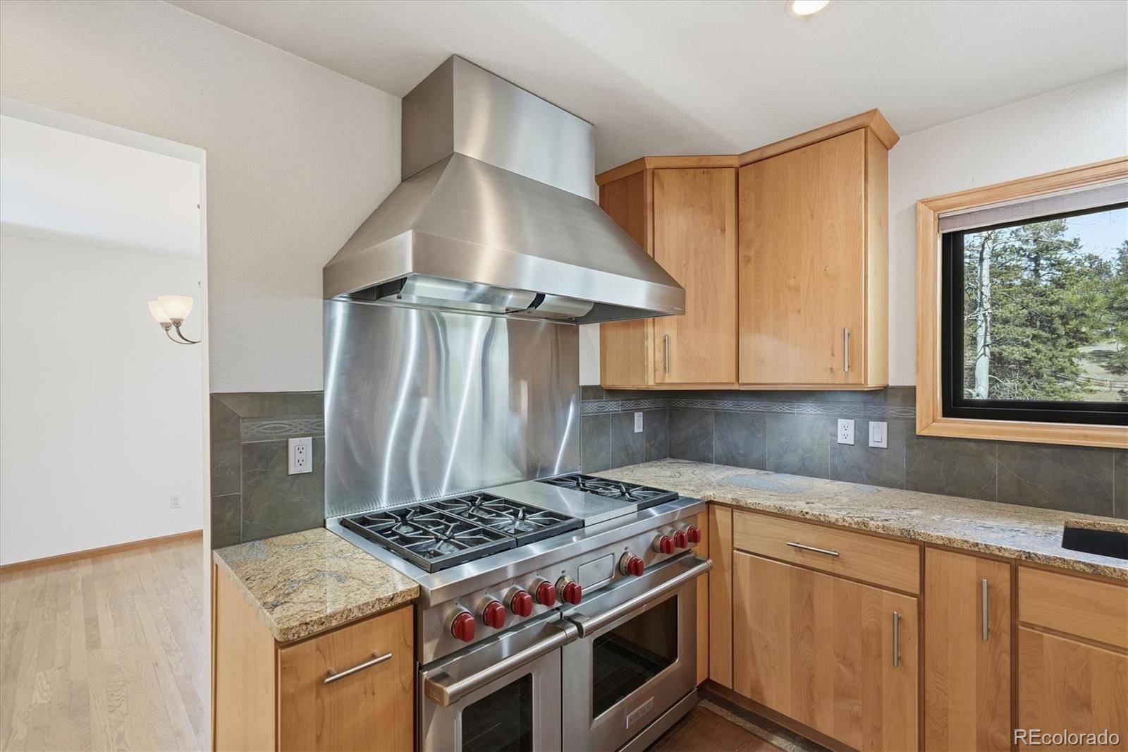 2565 Nova Road Pine, CO 80470 - Photo 7 of 50 a kitchen with a stove and a sink