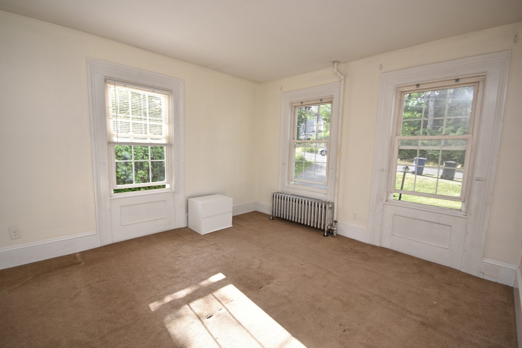 487 Main Street Amherst, MA 01002 - Photo 17 of 39 a view of an empty room with a window