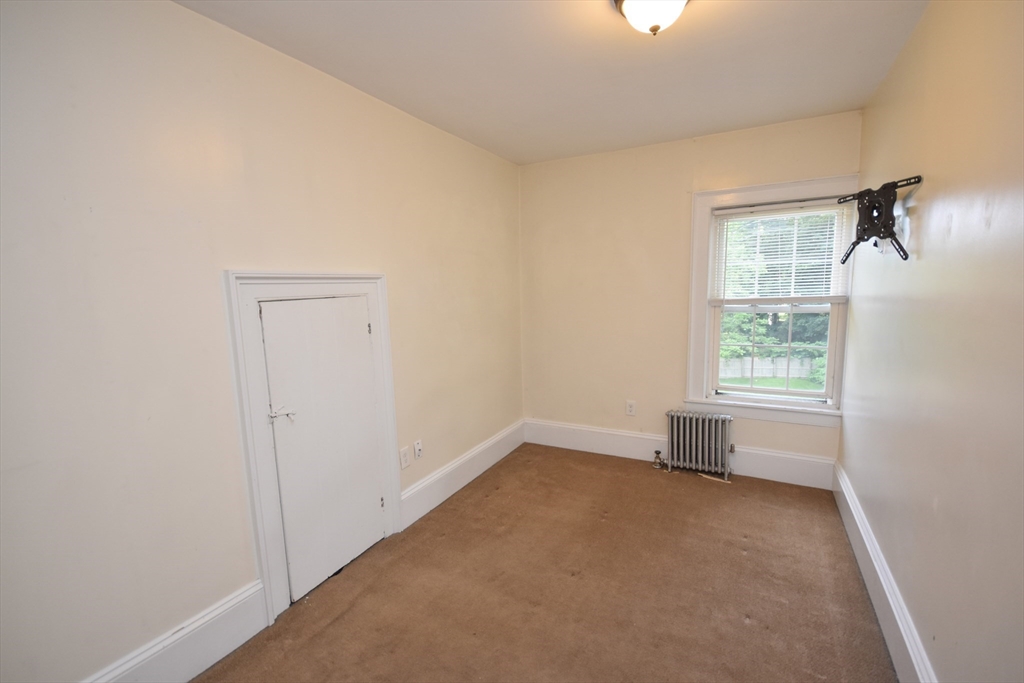 487 Main Street Amherst, MA 01002 - Photo 27 of 39 an empty room with a window