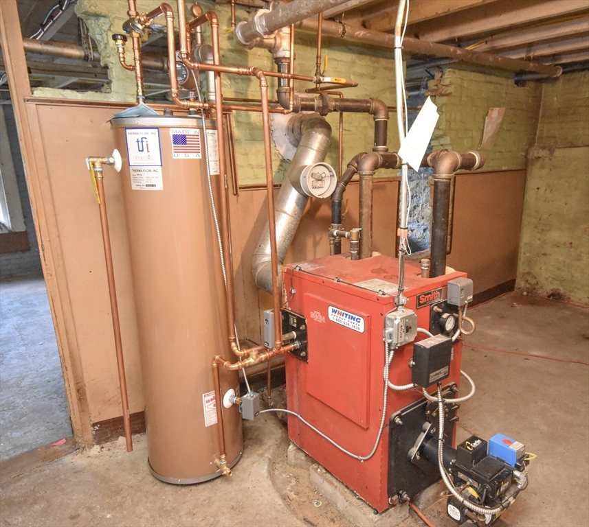 487 Main Street Amherst, MA 01002 - Photo 32 of 39 a room with water heater and storage