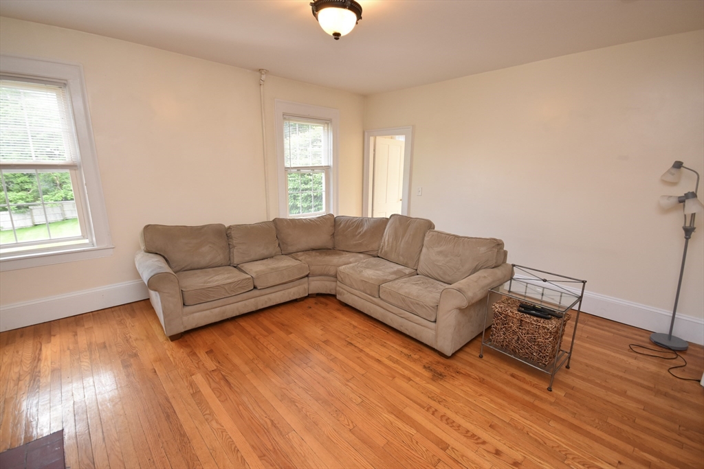 487 Main Street Amherst, MA 01002 - Photo 7 of 39 a living room with furniture and a window