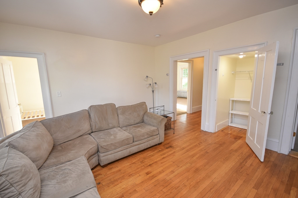 487 Main Street Amherst, MA 01002 - Photo 8 of 39 a living room with furniture and a window