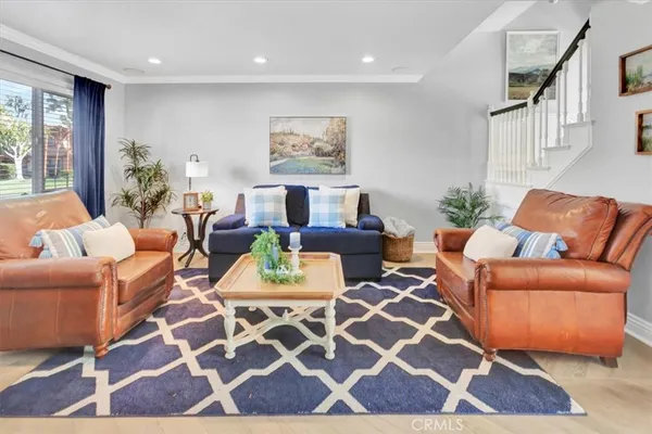 a living room with furniture and a rug