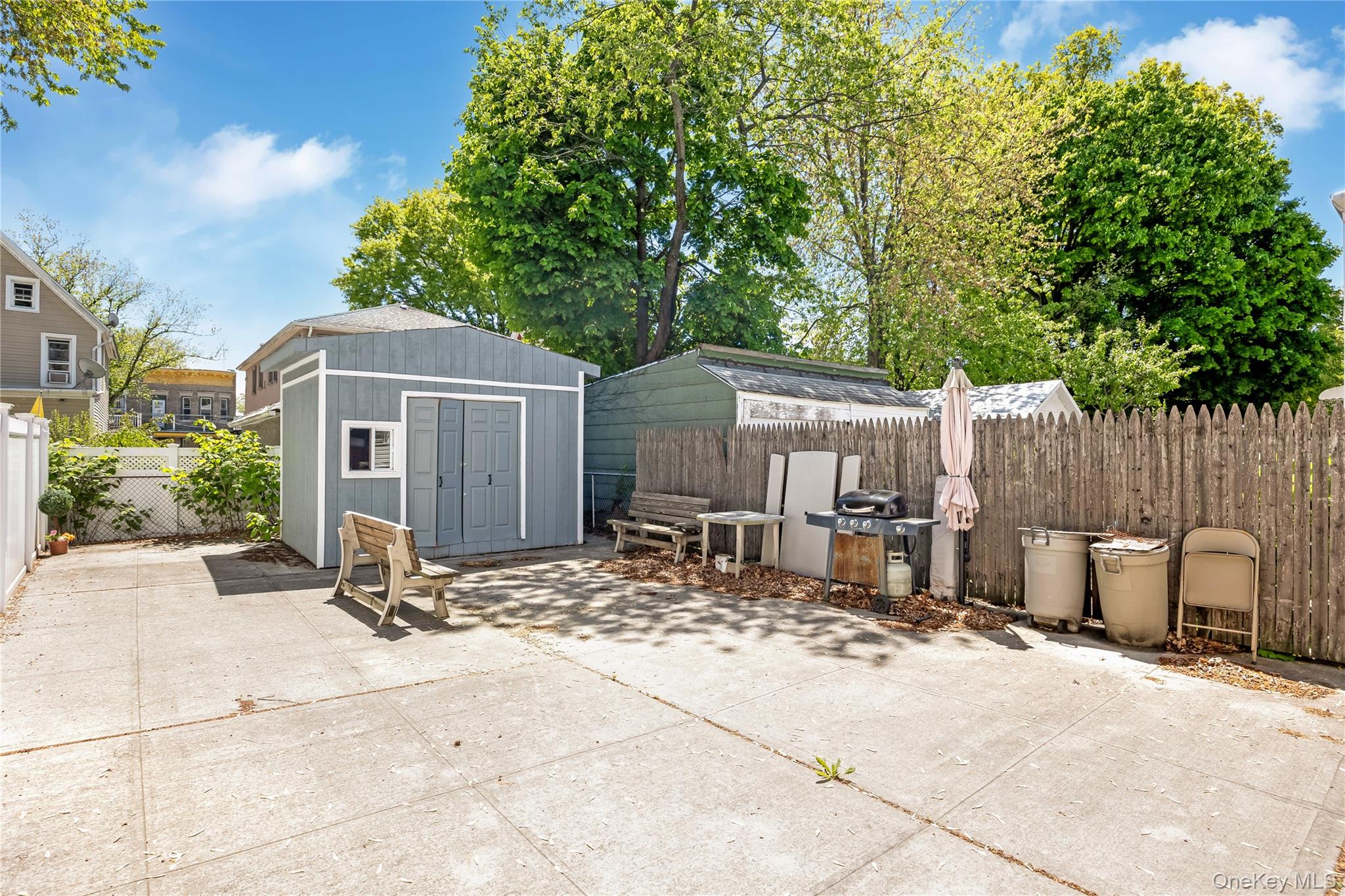 80-50 88th Road Queens, NY 11421 - Photo 21 of 21 a view of a house with backyard and sitting area