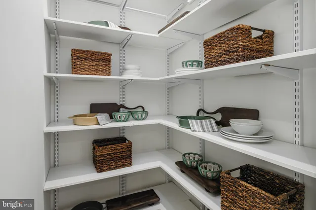 a room with a washing machine and cabinets