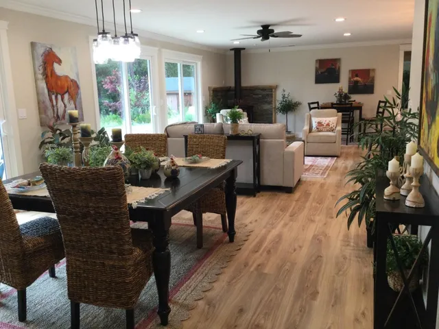 a en suite bathroom with a granite countertop tub and a wooden floor