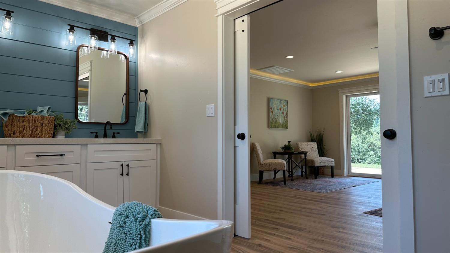 5110 Sly Park Road Pollock Pines, CA 95726 - Photo 18 of 86 a en suite bathroom with a granite countertop tub and a wooden floor