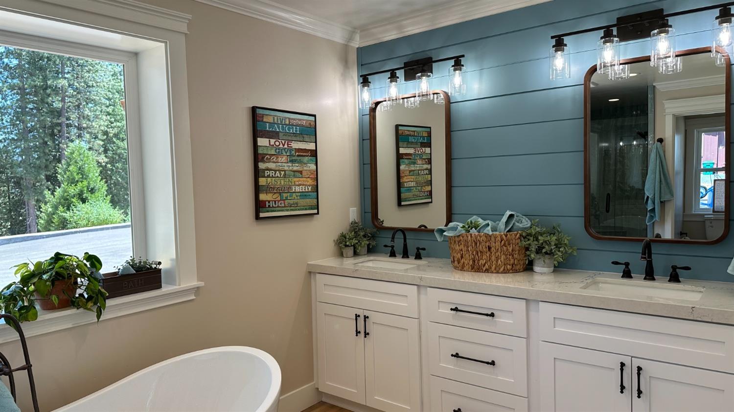 5110 Sly Park Road Pollock Pines, CA 95726 - Photo 20 of 86 a bathroom with double vanity sink a toilet and a mirror