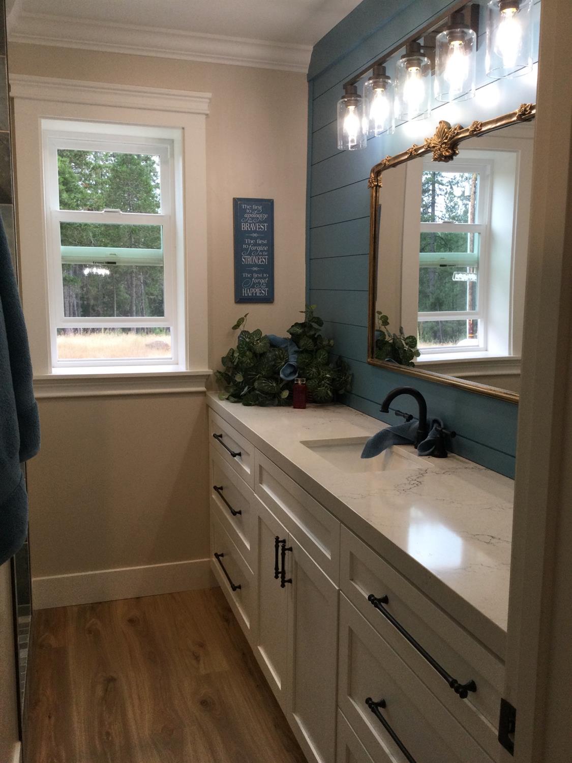 5110 Sly Park Road Pollock Pines, CA 95726 - Photo 27 of 86 a bathroom with a sink and a large mirror