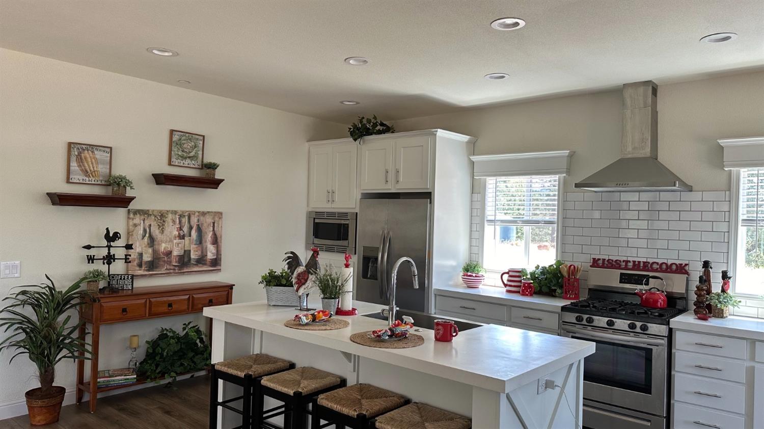 5110 Sly Park Road Pollock Pines, CA 95726 - Photo 68 of 86 a kitchen with stainless steel appliances a stove a sink dishwasher a table and chairs
