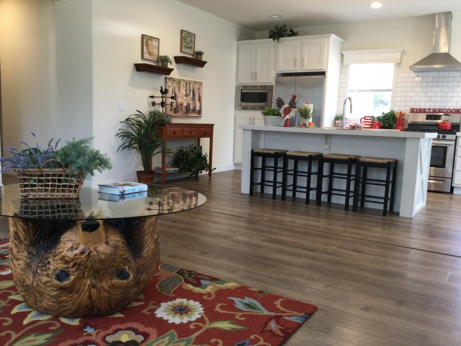 5110 Sly Park Road Pollock Pines, CA 95726 - Photo 72 of 86 a kitchen with a table chairs refrigerator and a oven