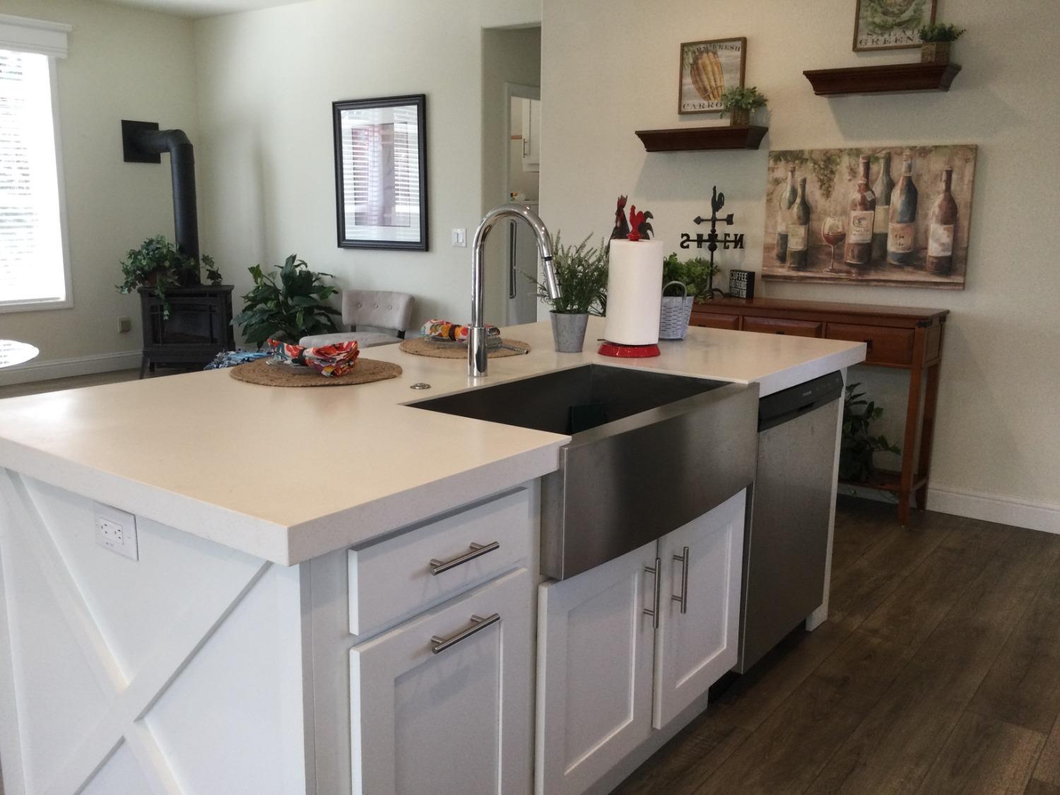 5110 Sly Park Road Pollock Pines, CA 95726 - Photo 74 of 86 a kitchen with stainless steel appliances a sink and a refrigerator