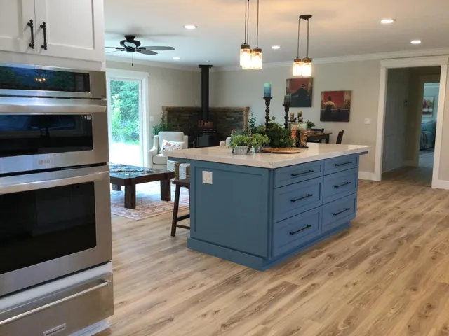 a view of a kitchen counter space and wooden floor