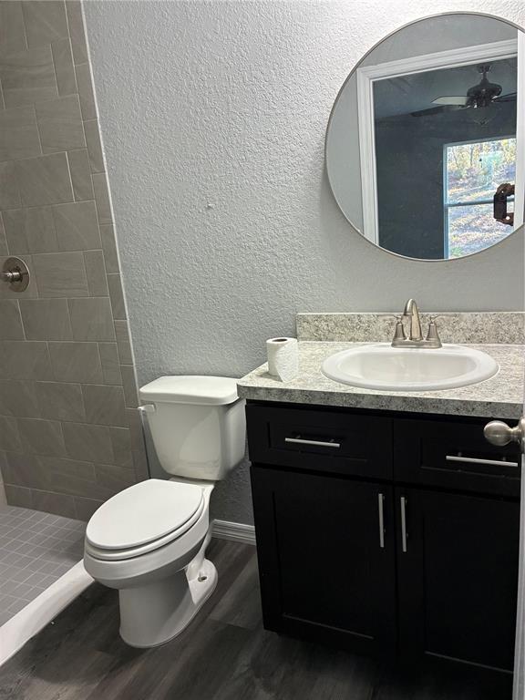 13033 Southwest 82nd Ave Road Ocala, FL 34473 - Photo 16 of 27 a bathroom with a granite countertop toilet sink and mirror