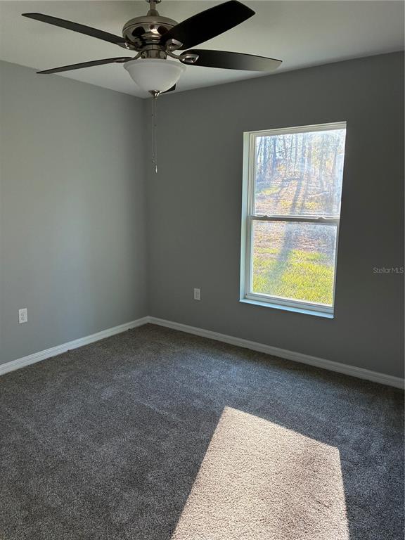13033 Southwest 82nd Ave Road Ocala, FL 34473 - Photo 21 of 27 an empty room with a window