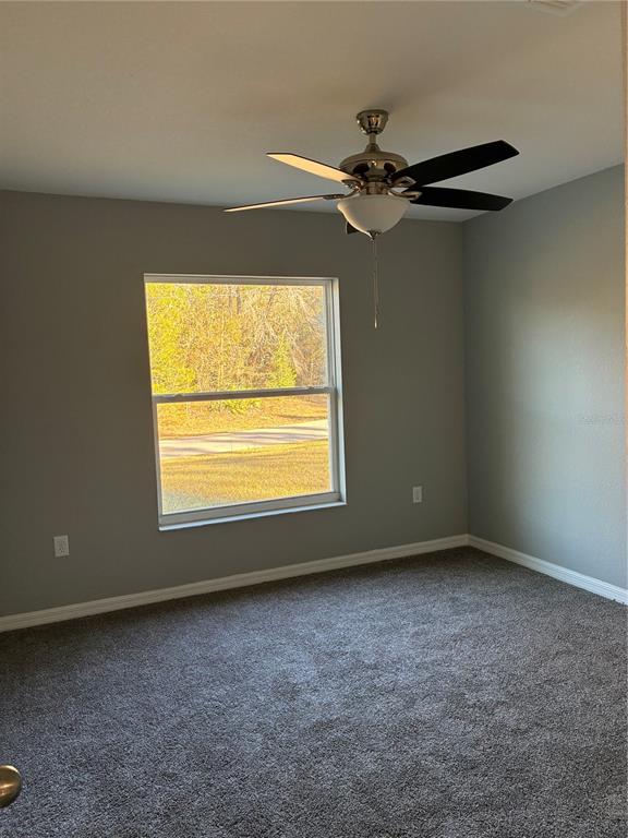 13033 Southwest 82nd Ave Road Ocala, FL 34473 - Photo 23 of 27 an empty room with a window