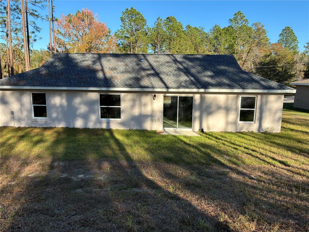 13033 Southwest 82nd Ave Road Ocala, FL 34473 - Photo 3 of 27 a view of house with a yard
