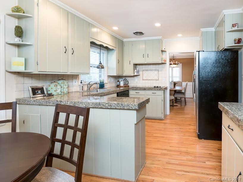 5600 Robinhood Road Charlotte, NC 28211 - Photo 3 of 22 a kitchen with refrigerator and cabinets