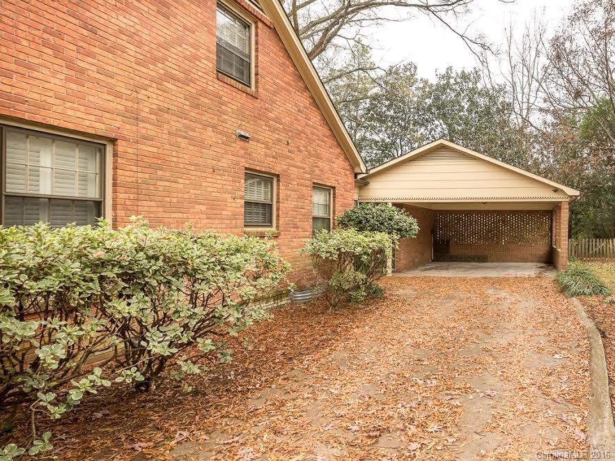 5600 Robinhood Road Charlotte, NC 28211 - Photo 21 of 22 a front view of a house with a yard and garage