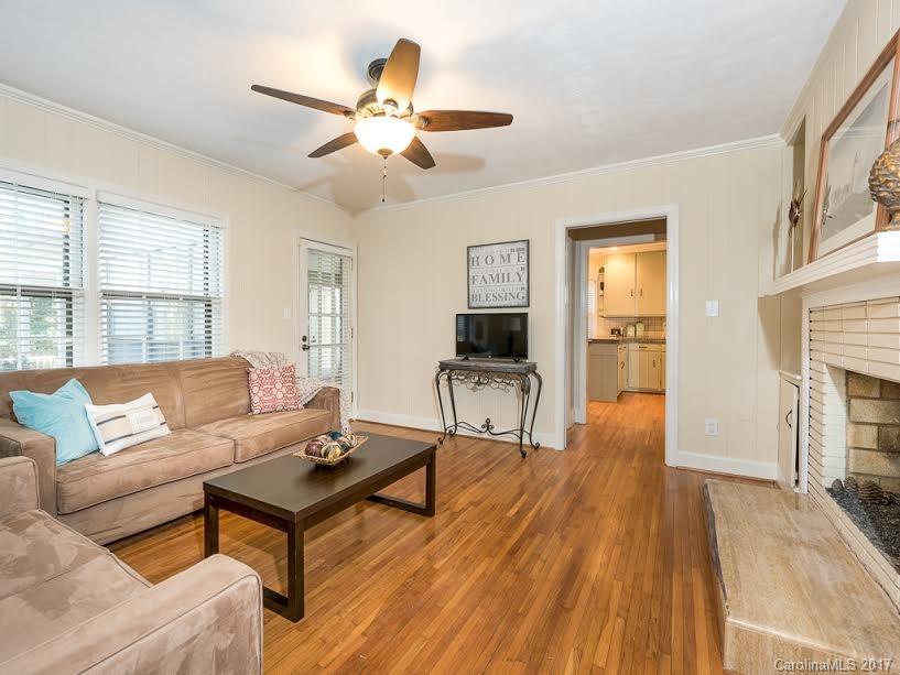 5600 Robinhood Road Charlotte, NC 28211 - Photo 7 of 22 a living room with furniture and a fireplace
