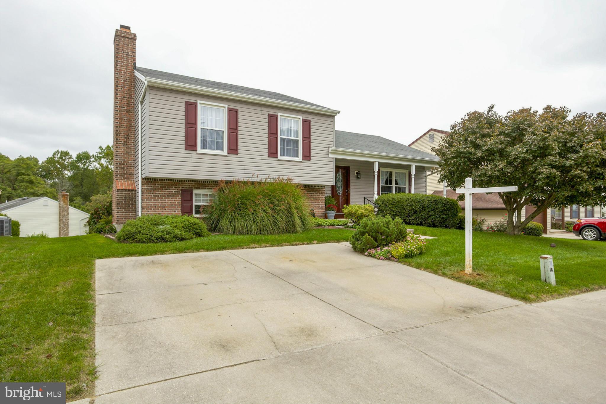 9407 Oak White Road Baltimore, MD 21236 - Photo 2 of 30 a front view of house with yard and green space