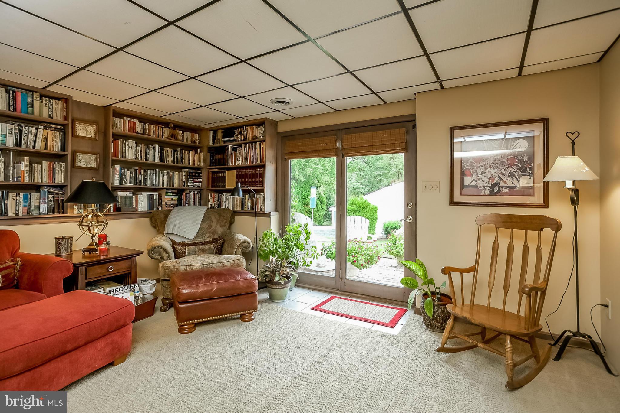 9407 Oak White Road Baltimore, MD 21236 - Photo 13 of 30 a living room with furniture and a floor to ceiling window