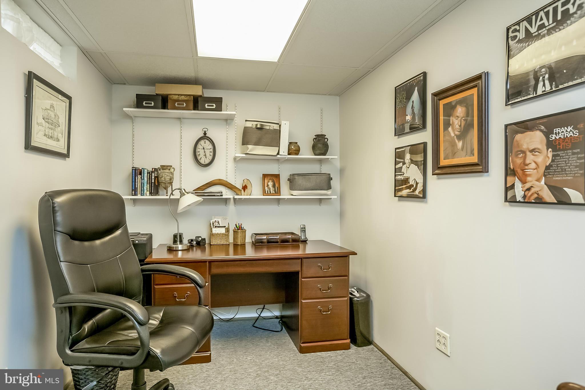 9407 Oak White Road Baltimore, MD 21236 - Photo 17 of 30 a room with furniture and painting on the wall