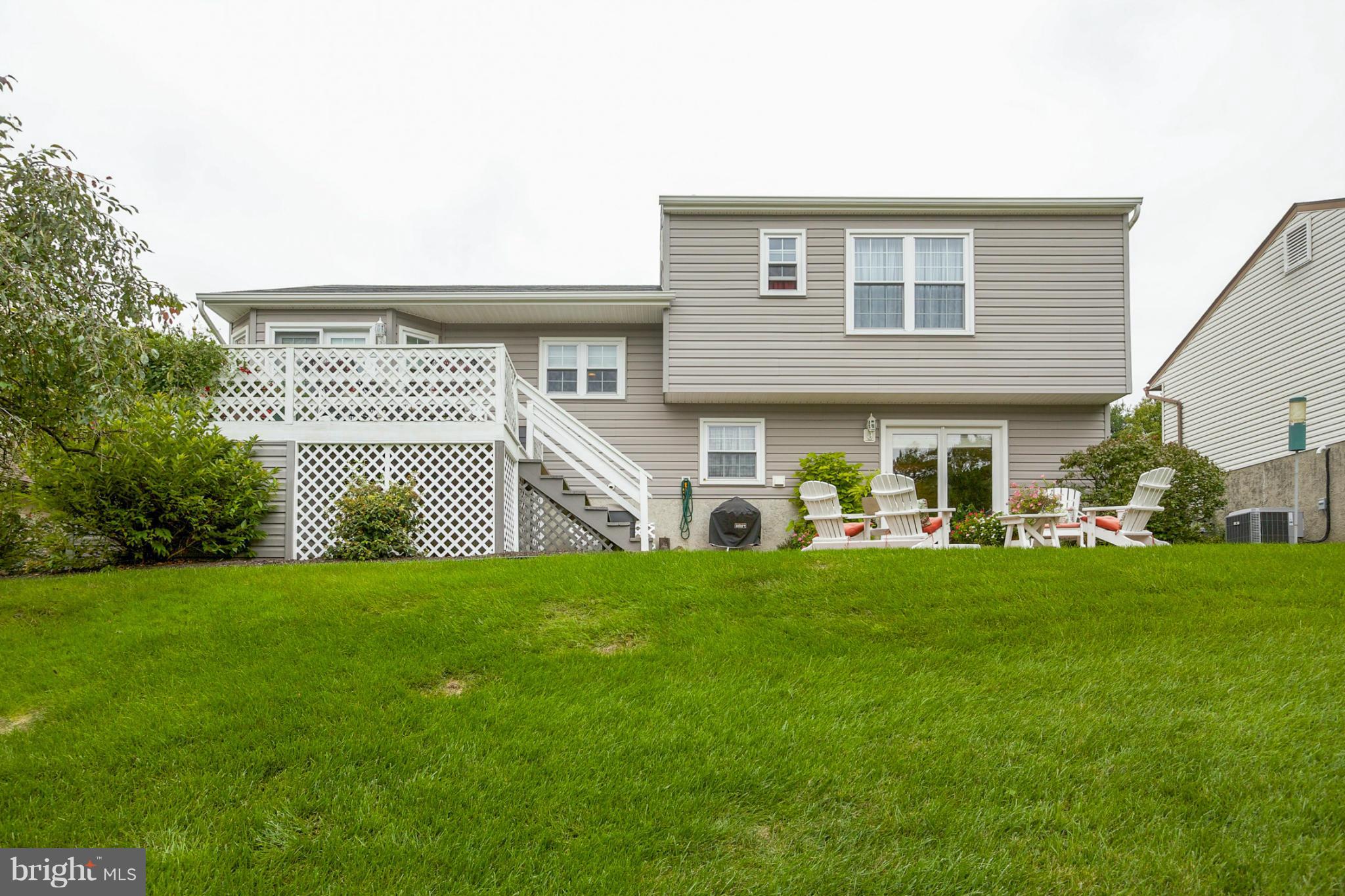 9407 Oak White Road Baltimore, MD 21236 - Photo 29 of 30 a front view of a house with a garden