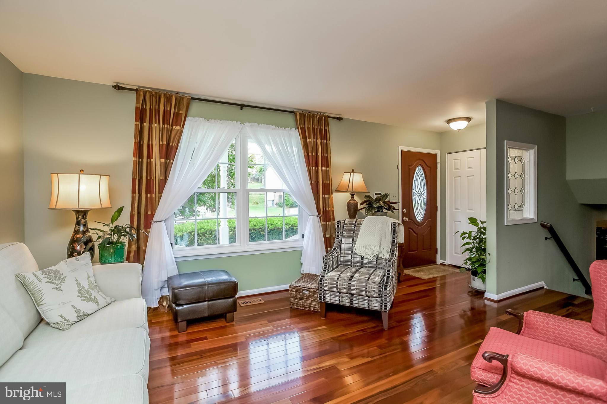 9407 Oak White Road Baltimore, MD 21236 - Photo 5 of 30 a living room with furniture and a large window