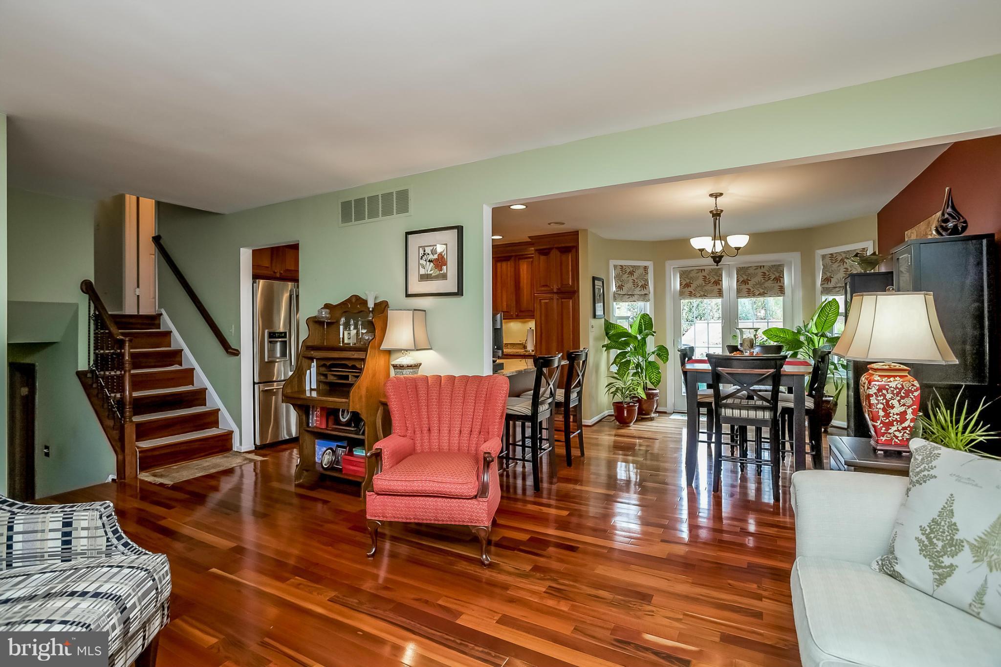 9407 Oak White Road Baltimore, MD 21236 - Photo 30 of 30 a living room with furniture a rug and wooden floor