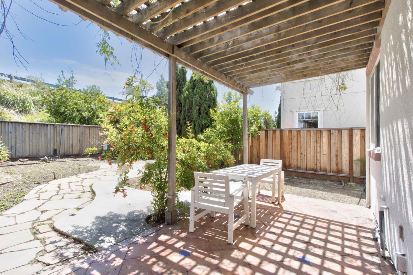 2715 Shellgate Circle Hayward, CA 94545 - Photo 40 of 47 a patio with yard table and chairs and potted plants