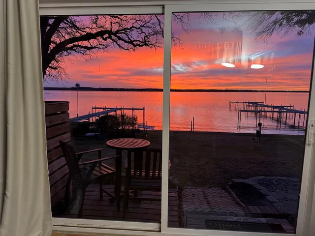 a view of a balcony with chairs and a table