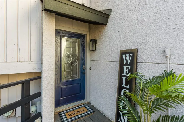 an aerial view of a house with outdoor space and lake view