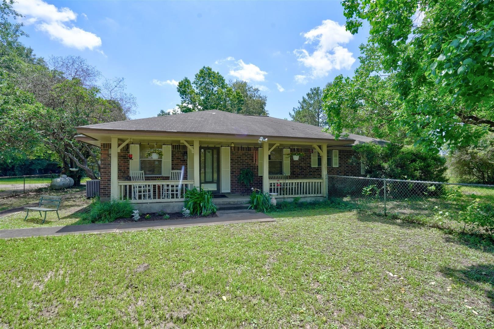 15771 1st Street Splendora, TX 77372 - Photo 1 of 47 a view of a house with a yard
