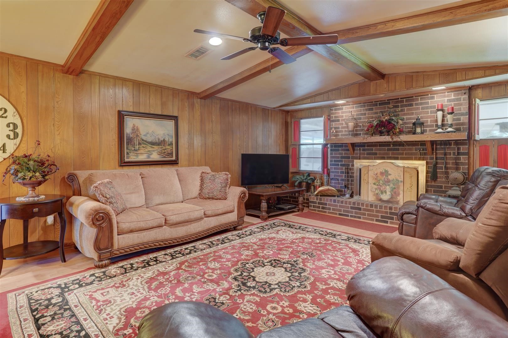 15771 1st Street Splendora, TX 77372 - Photo 14 of 47 a living room with furniture and a fireplace