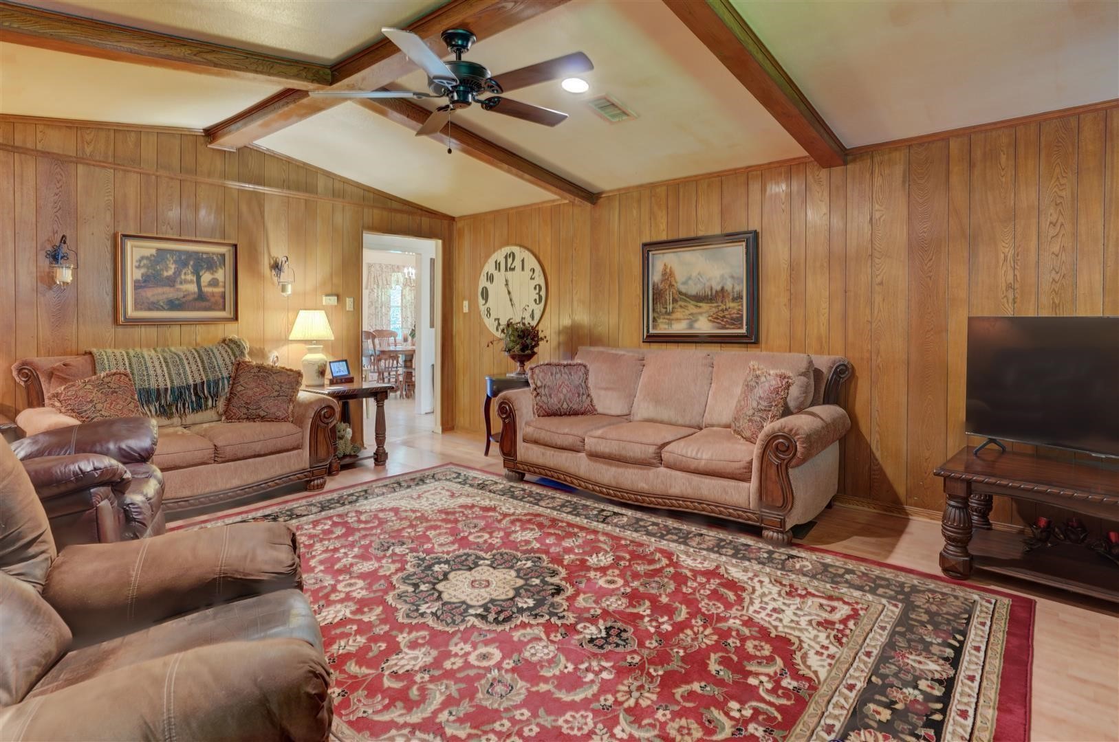 15771 1st Street Splendora, TX 77372 - Photo 15 of 47 a living room with furniture and a flat screen tv