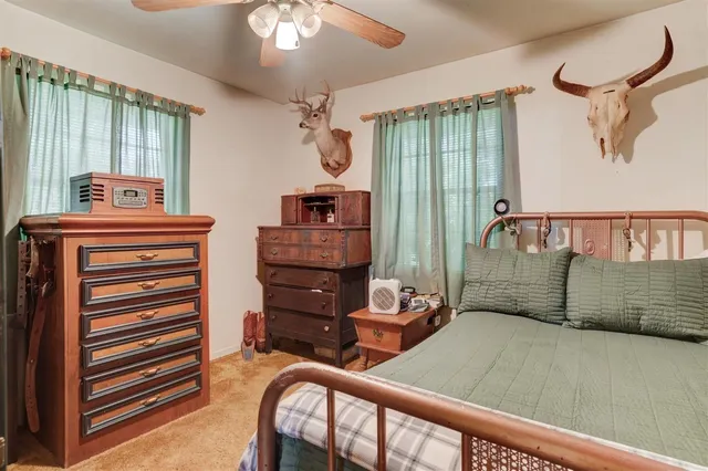 a bedroom with furniture and a window
