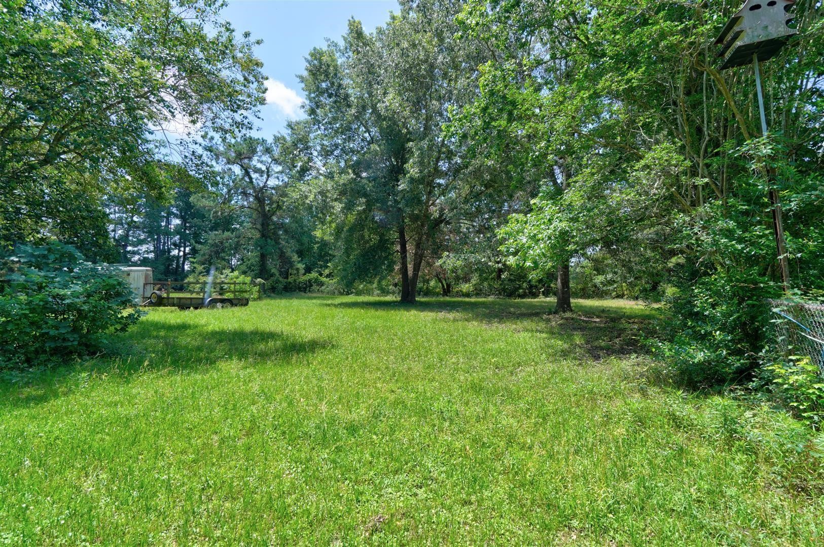 15771 1st Street Splendora, TX 77372 - Photo 35 of 47 a view of outdoor space with deck and yard