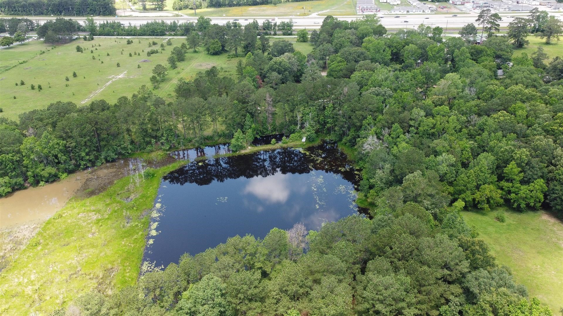 15771 1st Street Splendora, TX 77372 - Photo 45 of 47 an aerial view of a houses with a yard